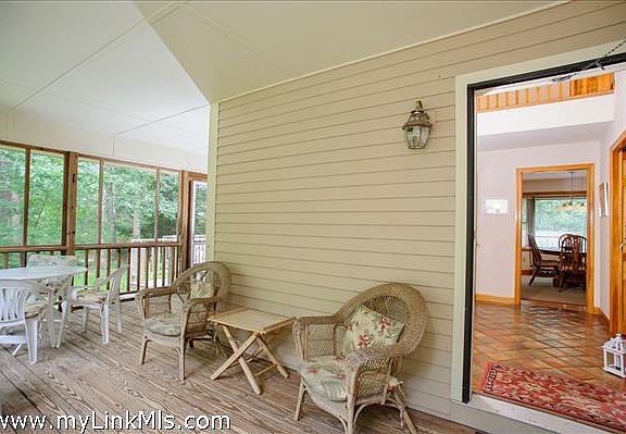 ...and a fabulous screened porch that greets you upon entering.