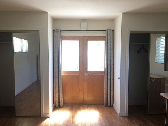 French door entrance with double closets on two sides