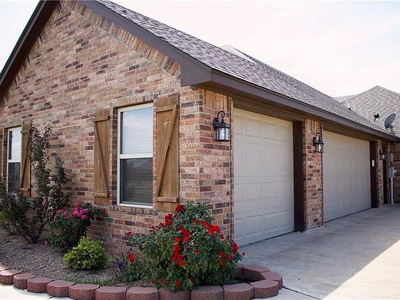 Three Car Garage With In-Ground Storm Shelter