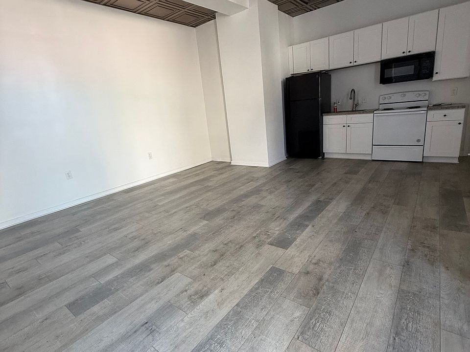 Another POV of kitchen / living room layout.