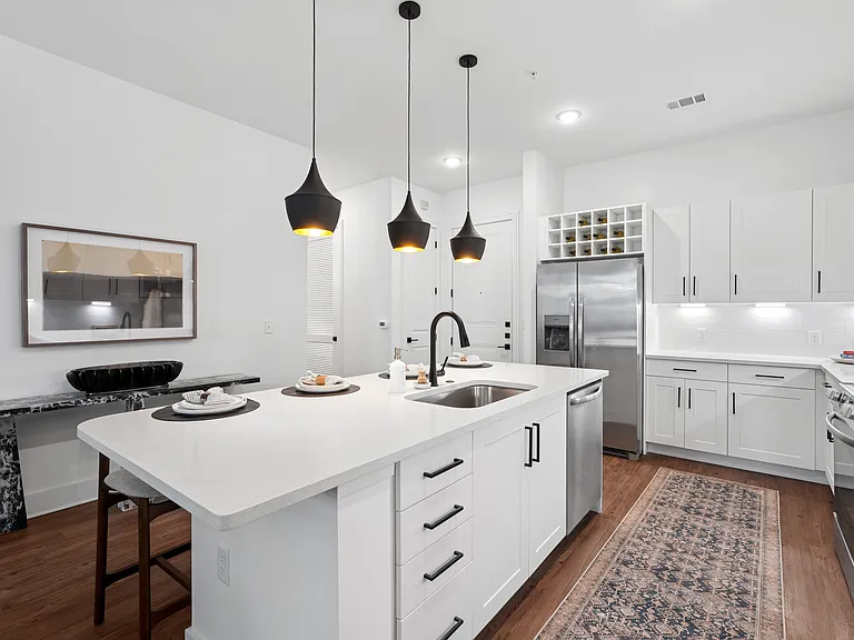 Kitchen Island with Seating Space and View into Living Room
