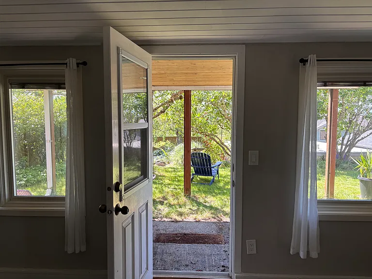 Second outside door from living/bedroom to covered area under upstairs deck