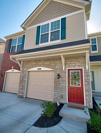 Front door and single car garage - This is a top unit