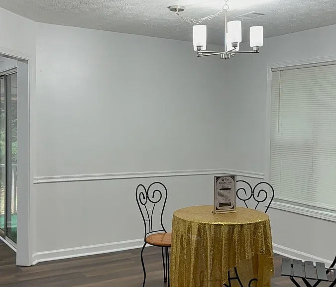 Dinning Room with fresh paint, new flooring and modern new light fixtures