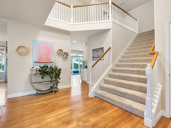 wide staircase, hardwood floors throughout main. >