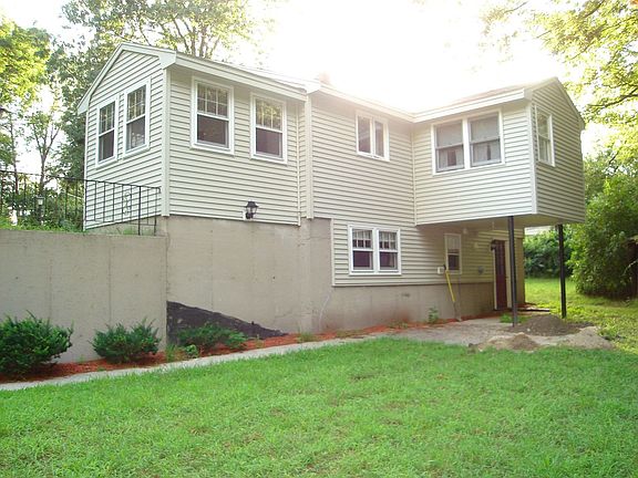 Rear view of house with large backyard