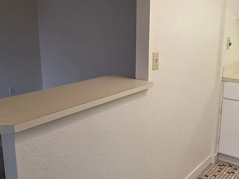 Convenient eating bar between living room and kitchen