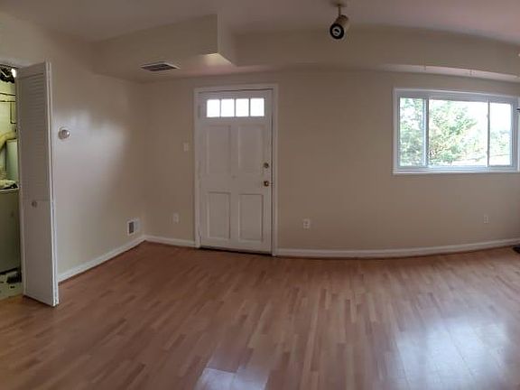 first floor: entrance to laundry room, exit to deck, stairs to second level