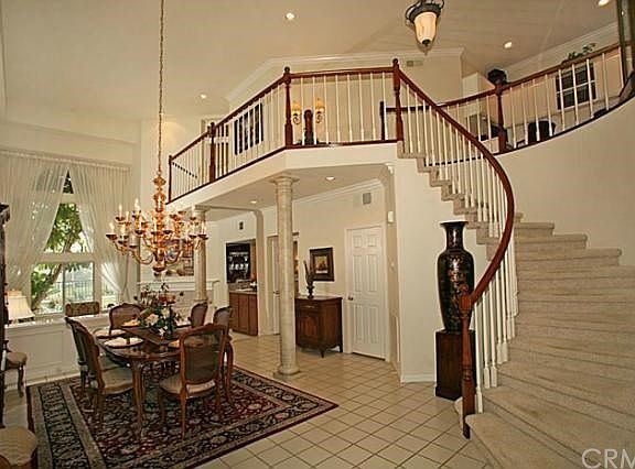 Soaring Ceilings and a Grand Staircase in the Formal Entry, Crown Moldings, Plantation Shutters, Leaded Glass, and More in this Desirable Roma floor plan.