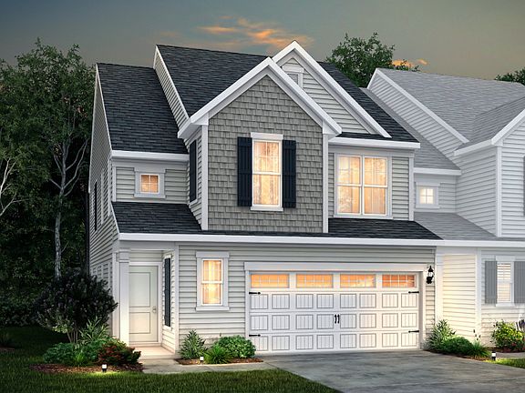 Palomino Exterior 1 features siding, shakes, covered front door and 2-car front load garage