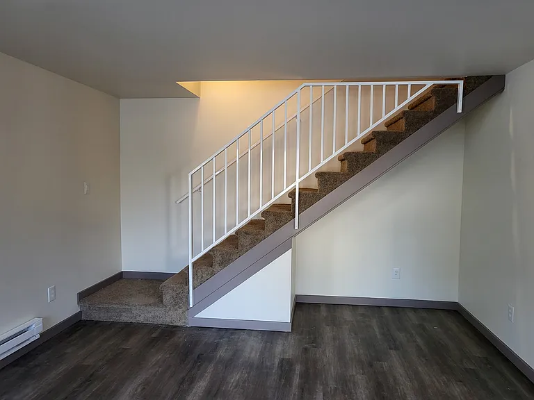 Stairway leading upstairs to two spacious bedrooms, the laundry area and bathroom. Master bedroom has a huge walk-in closet!