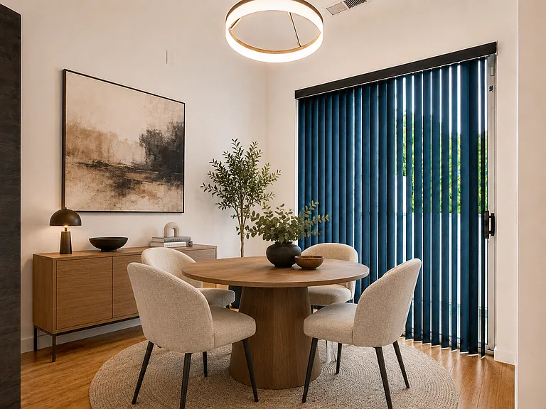 Virtually Stages Dining Area from the facing the sliding glass door leading to one of the balconies.