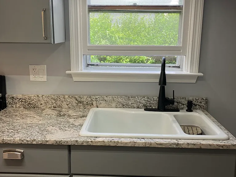 Newly renovated kitchen with granite and stainless steel appliances.
