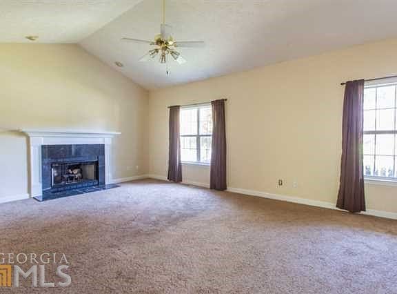 FAMILY ROOM WITH GAS FIRELACE AND TONS OF NATURAL LIGHT