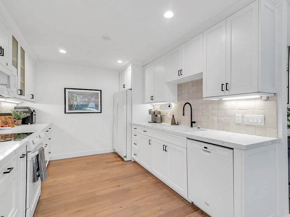 Contemporary finishes. Kitchen is designed for flow, storage, and convenience