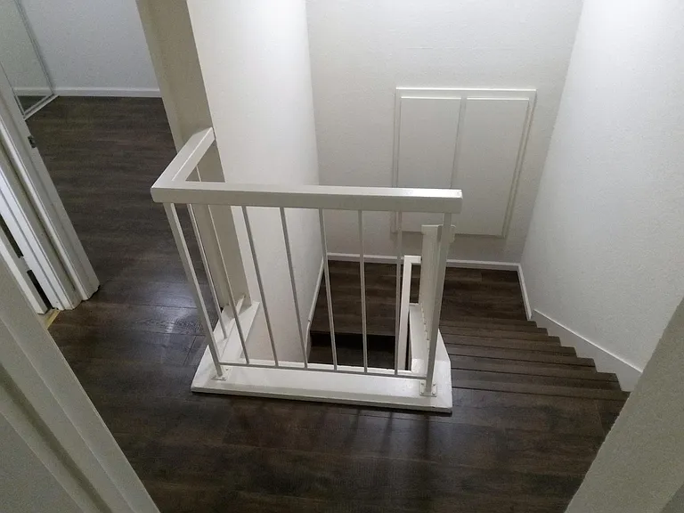 Upstairs Hallway looking downstairs with Pergo Flooring