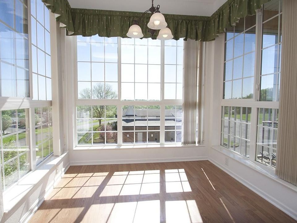 Bright morning light floods in floor to ceiling windows