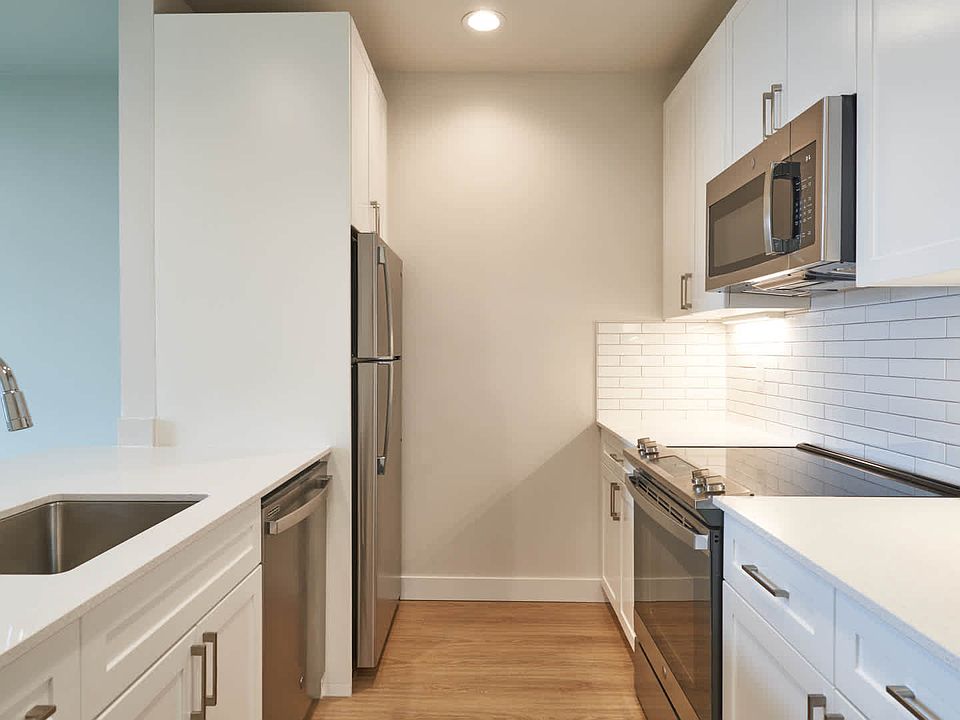 Kitchen with Quartz Countertops and Stainless Steel Appliances