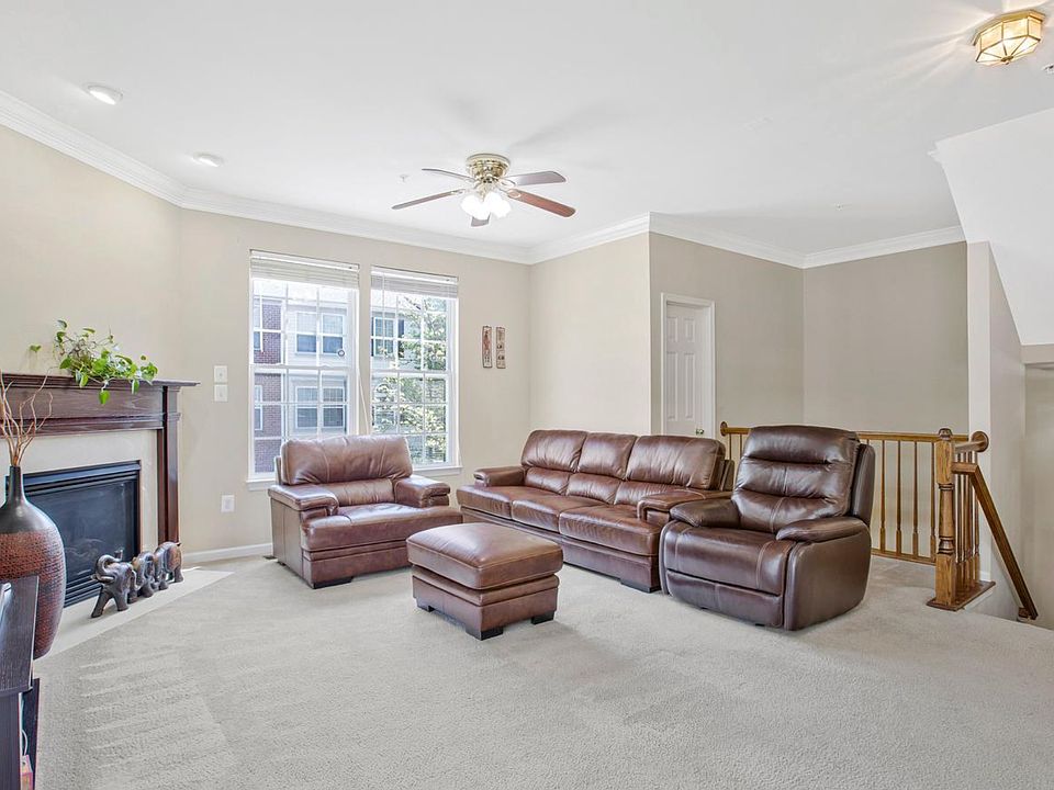 Natural light pours into this living room, creating the kind of warmth and energy that instantly makes a house feel like home.