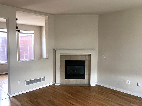 Living room with gas fireplace.