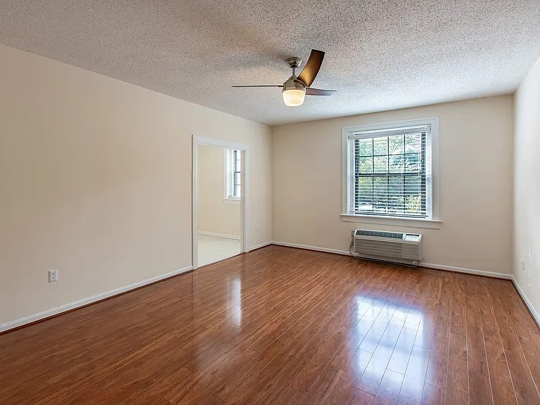 Bedroom with view of tree line