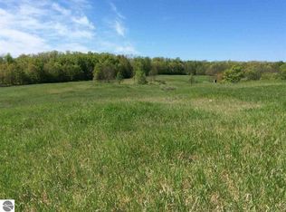 7693 Saddle Horn Dr, Grawn, MI 49637