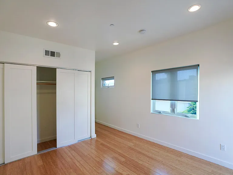 Front Bedroom Closet and Hallway Leading to Bathroom