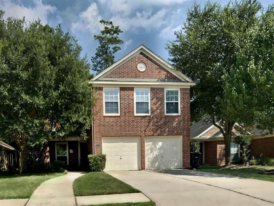Timeless traditional Red Brick with mature trees and inviting covered front porch big enough for outdoor furniture!