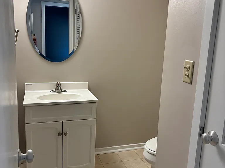 Half bath, connects to walk-through tub and shower