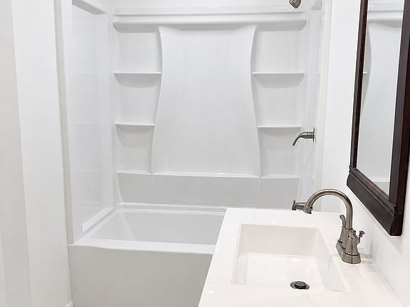 Newly Remodeled Bathroom with Tub and Shower