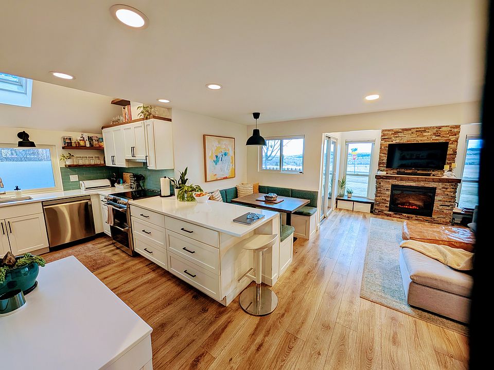 Kitchen, dining area and living area.