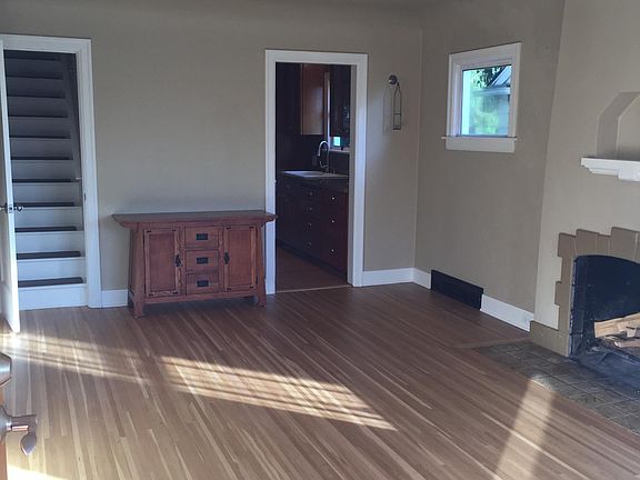 Livingroom - stairs to master bedroom suite, door to kitchen