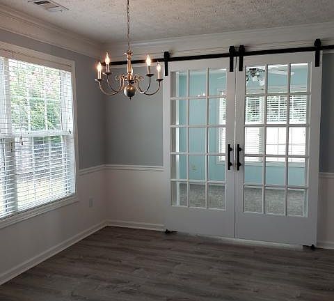 dining room with sunroom beyond