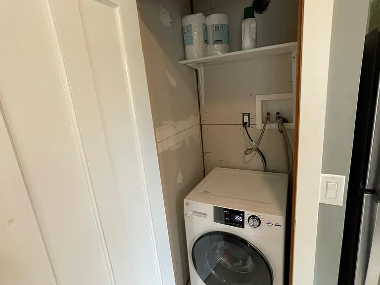 Downstairs closet with washer/dryer combo