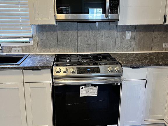 Brand New Range and Built In Microwave