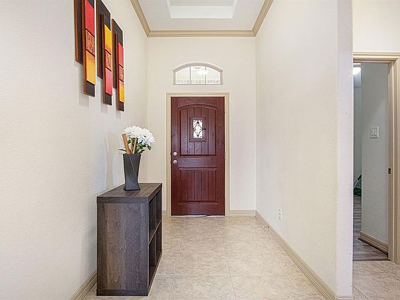 Pretty entry hall provides privacy before entering the heart of the home.