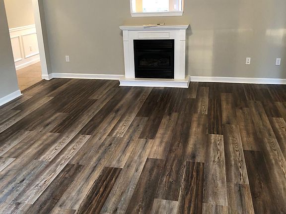 View from the front door (living room). As one looks above the fireplace opening is the kitchen. To the left is the master bedroom and bathroom.