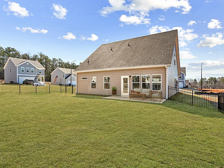Back patio with a large fenced in yard.