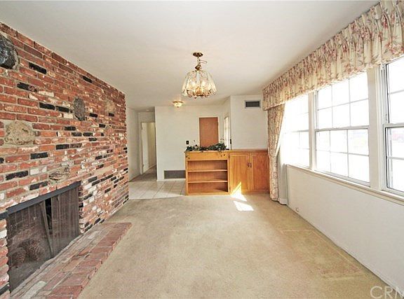 Impressive brick-finished fireplace in the living room