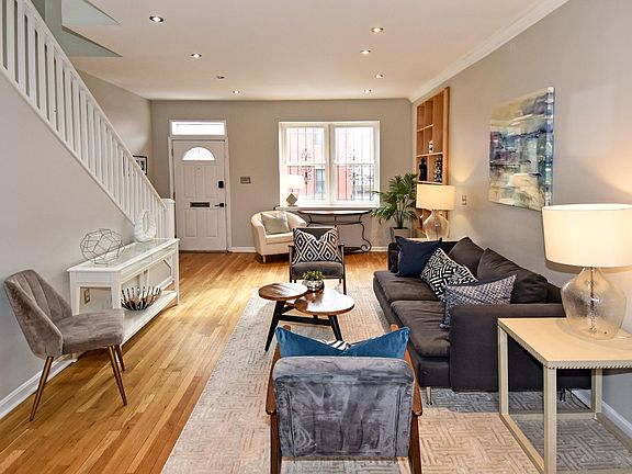 Build in bookcases & exposed brick give this home so much charm