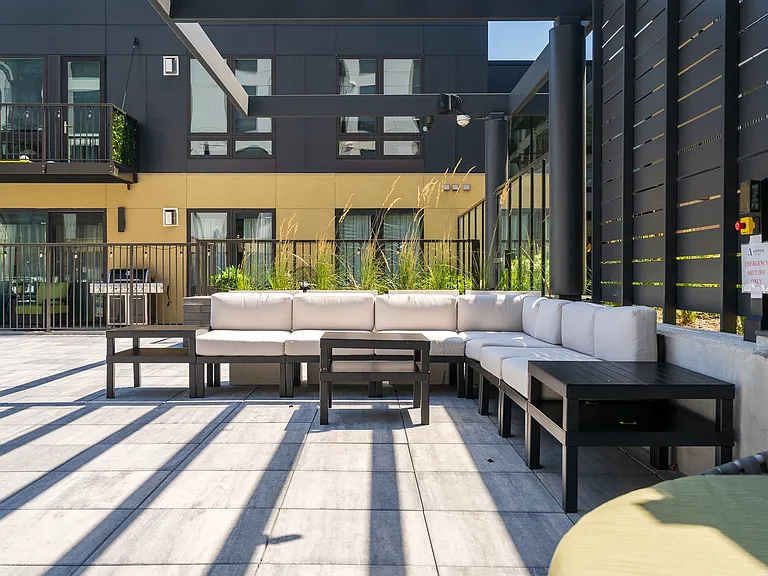 Relax and unwind in a stylish outdoor lounge perfect for gatherings.