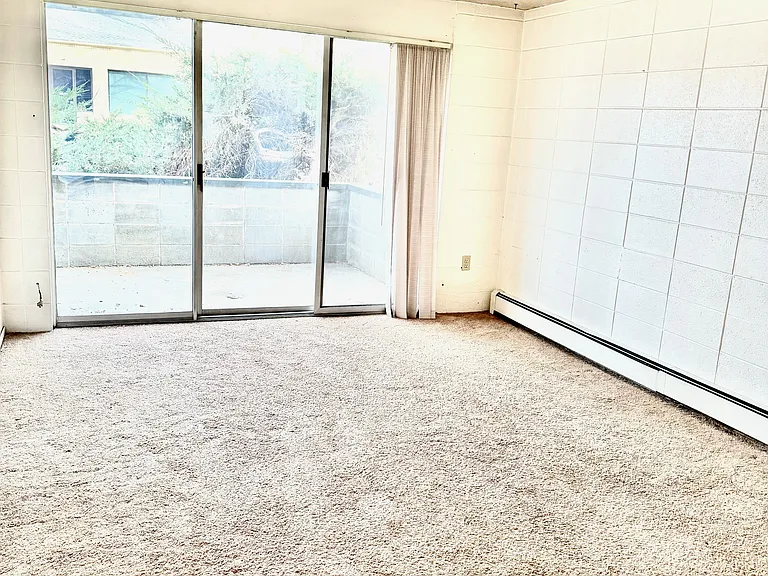 Living Room with sliding door exit to the patio