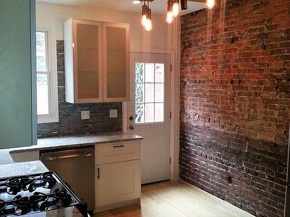 Kitchen and back door to fenced patio.