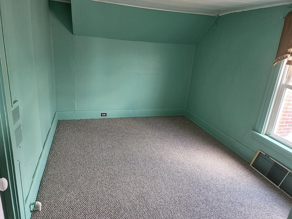 Bedroom next to bath with new carpeting.