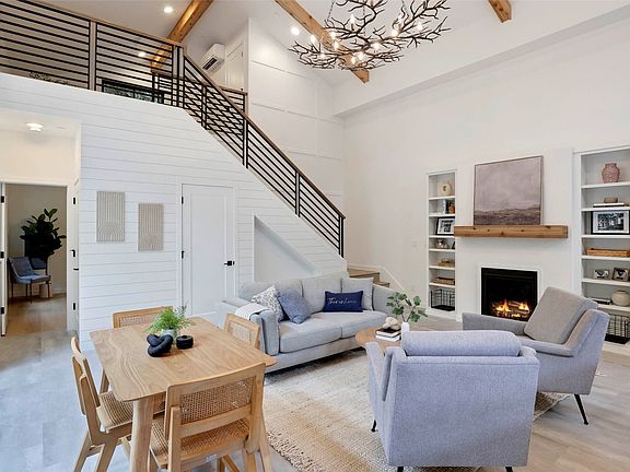 Welcome to this adorably cozy cottage style home with stunning architectural details.>