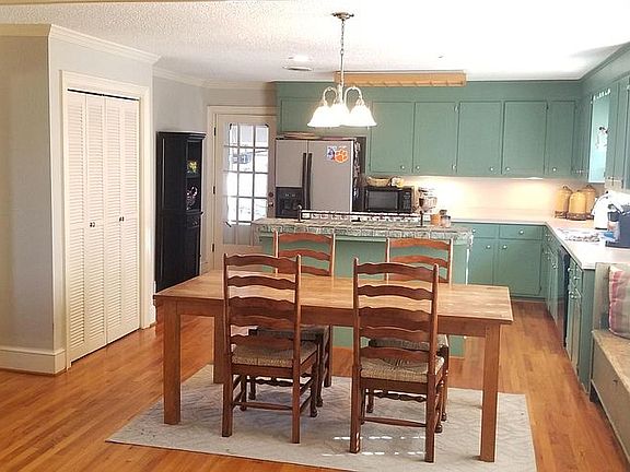 Spacious Kitchen, Dinette & closet pantry. Opening at left to dining room.