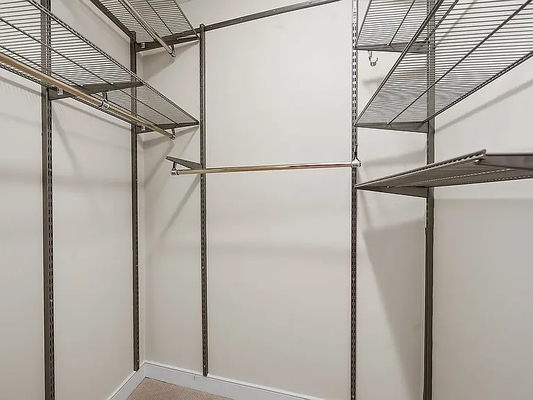 Walk-in closet attached to primary bedroom