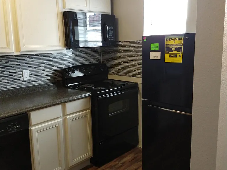 Updated kitchen, installed microwave, and new fridge.
