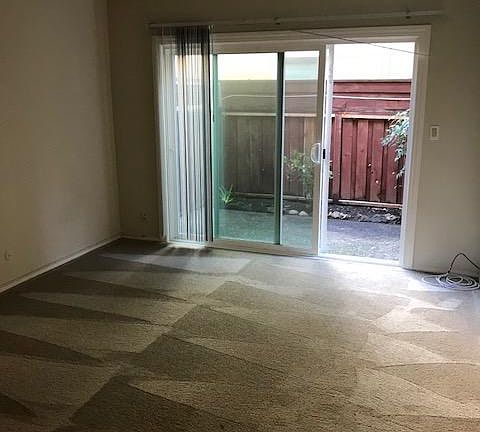 large bedroom with access to patio