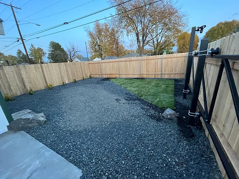 Secure parking behind fence and private backyard.